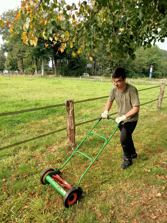 Werken met de kooimaaier bij een klant